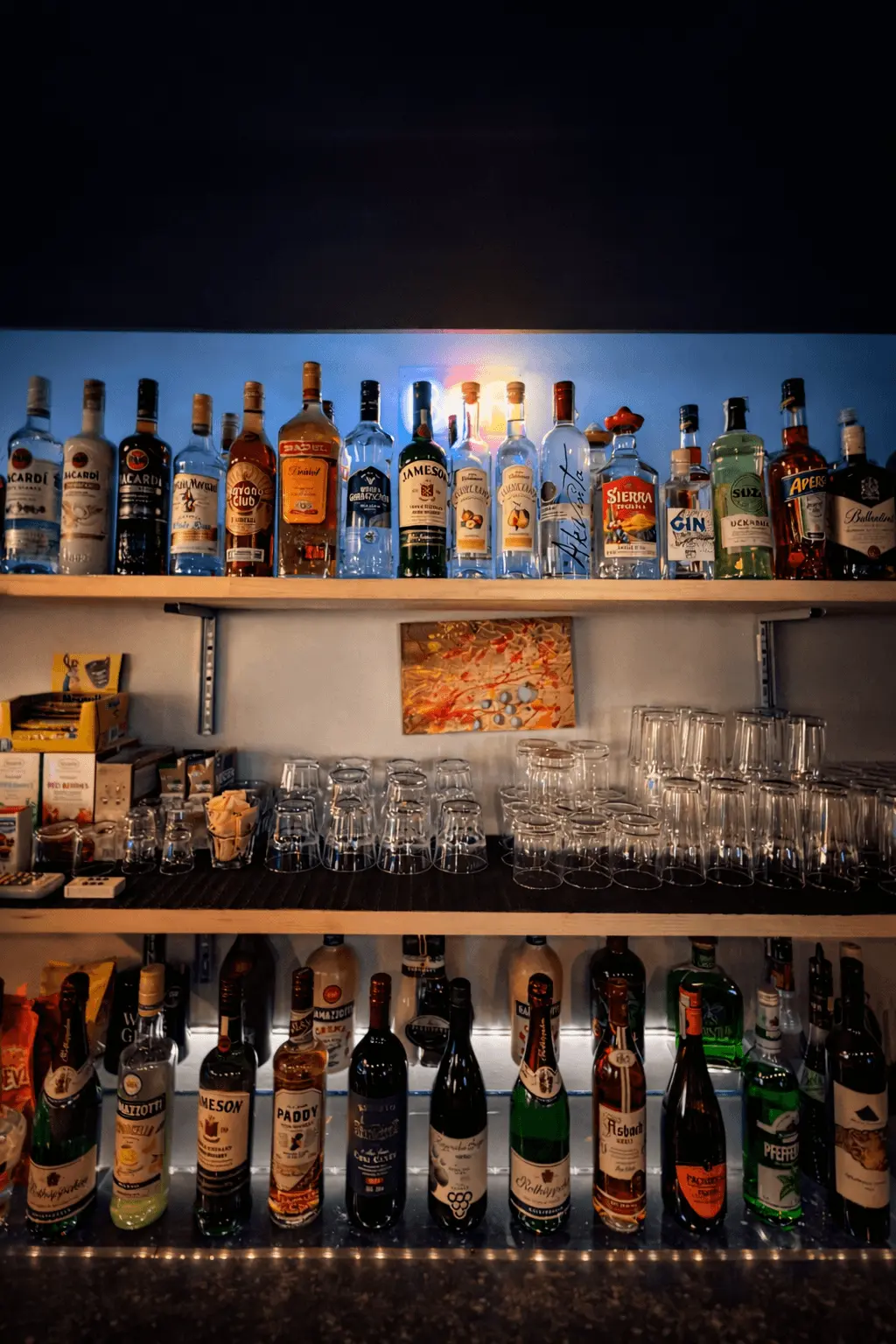 Warm bar shelf with liquor bottles